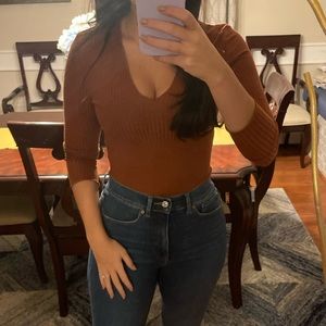 Burnt orange ribbed v neck bodysuit